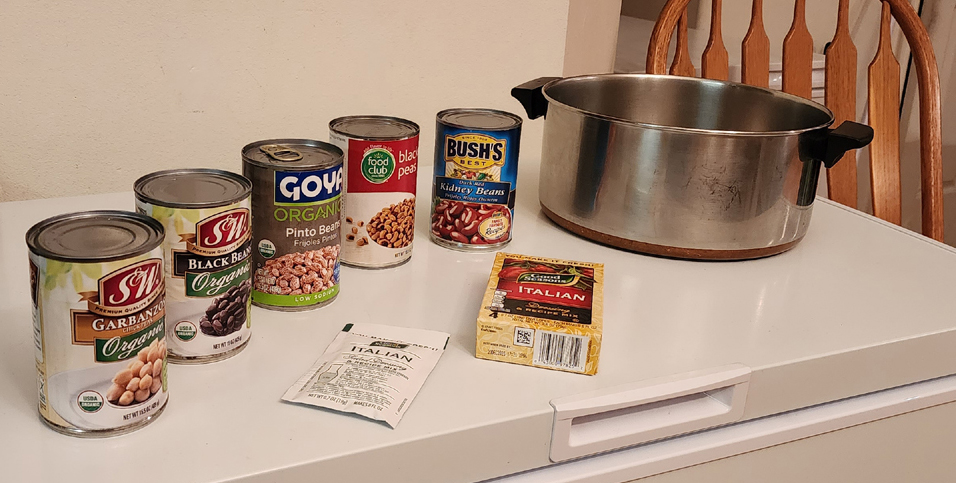Photo of 5 different cans of beans, Box of Good Seasons Italian Seasoning and a 6 quart copper bottom stock pot