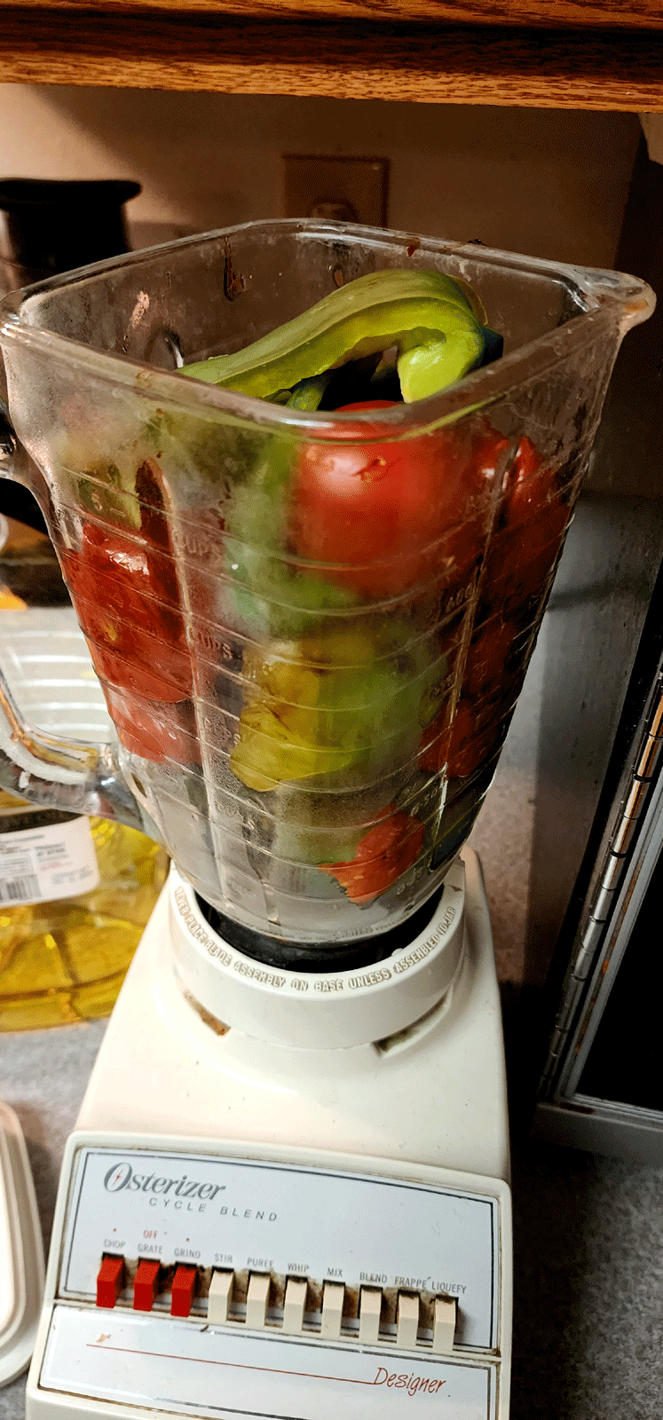 Animated photo Blender with unblended vegetables switches to blended vegetables