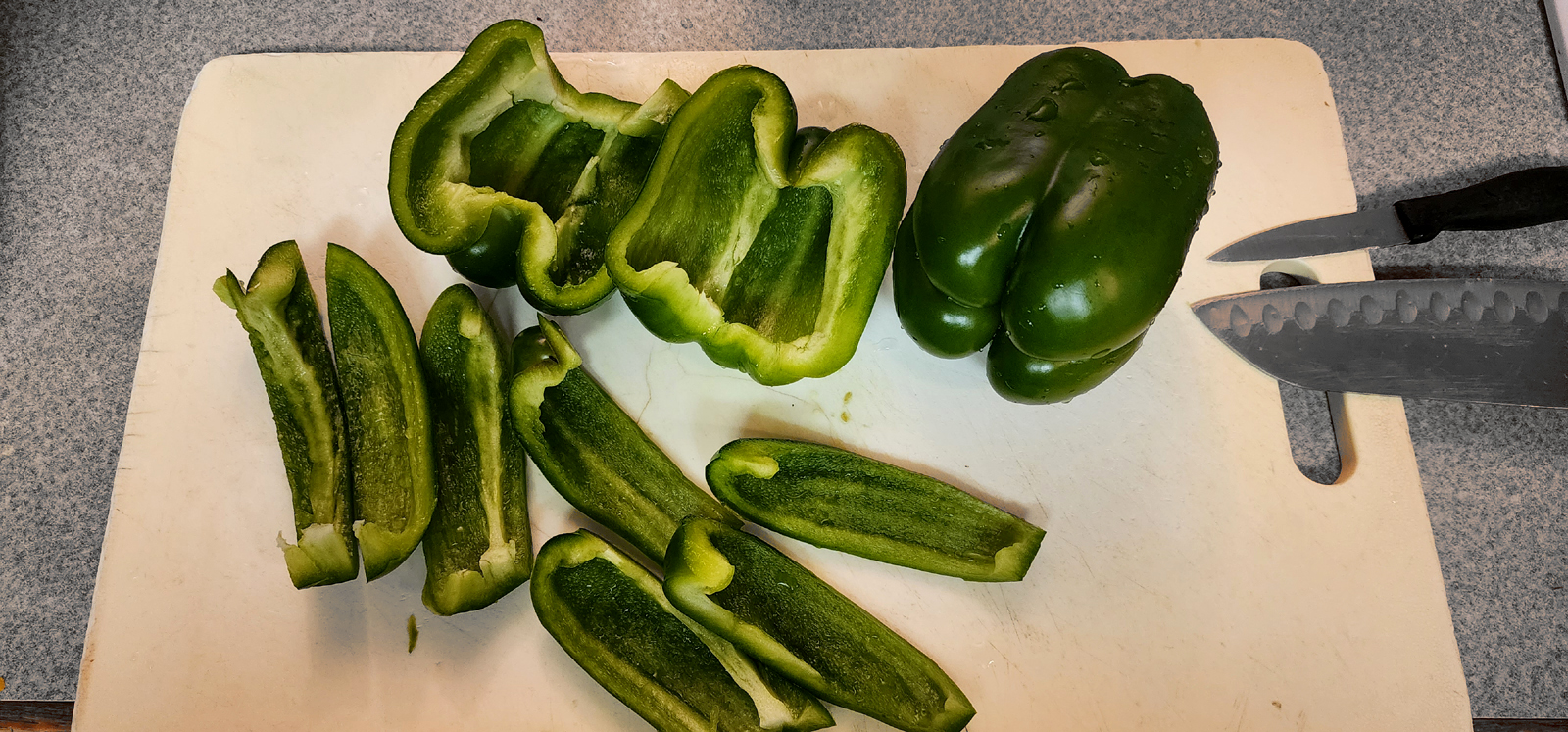 Green pappers on a cutting board